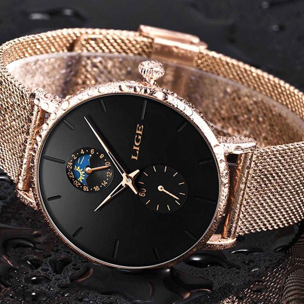 Rose gold watch with black online dial